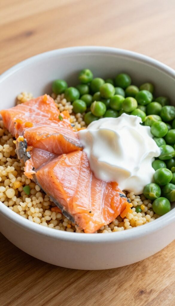 Dog bowl with salmon and couscous salad with peas and Greek yogurt, homemade dog meal